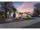 Charming single-story home featuring desert landscaping, a red tile roof, and a two-car garage at 2528 Sunup Dr, Las Vegas, NV 89134