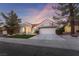 Charming home with well-maintained landscaping, a two-car garage, and a welcoming entrance at 2528 Sunup Dr, Las Vegas, NV 89134