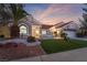 Charming single-story home featuring a red tile roof and nicely landscaped front yard, complete with desert accents at 2528 Sunup Dr, Las Vegas, NV 89134