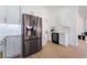 Modern kitchen with stainless steel appliances, wine cooler, and ample cabinet space at 2528 Sunup Dr, Las Vegas, NV 89134
