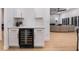 Stylish bar featuring designer cabinets and a built in wine refrigerator at 2528 Sunup Dr, Las Vegas, NV 89134