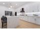Modern kitchen with large island, pendant lighting, and stainless steel appliances at 2528 Sunup Dr, Las Vegas, NV 89134