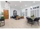 Open-concept space featuring a wooden door, living room, and dining area with sleek furnishings at 2528 Sunup Dr, Las Vegas, NV 89134