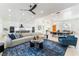 Spacious open-concept living area featuring modern furnishings, a dining area, and a sleek kitchen at 2528 Sunup Dr, Las Vegas, NV 89134