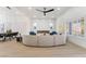 Bright, open-concept living area with modern lighting, fireplace, and stylish furniture at 2528 Sunup Dr, Las Vegas, NV 89134