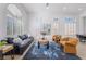 Bright living room with large windows, hardwood floors, and stylish decor and furnishings at 2528 Sunup Dr, Las Vegas, NV 89134