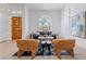 Inviting living room with large windows and comfortable seating, perfect for relaxing and entertaining at 2528 Sunup Dr, Las Vegas, NV 89134