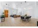 Bright living and dining area with modern lighting and stylish furnishings, perfect for Gathering at 2528 Sunup Dr, Las Vegas, NV 89134