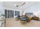 Spacious main bedroom with lots of natural light, light hardwood floors, and modern decor at 2528 Sunup Dr, Las Vegas, NV 89134