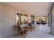 Relaxing covered patio featuring chairs and an outdoor living space at 2528 Sunup Dr, Las Vegas, NV 89134