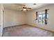 Bright bedroom with a ceiling fan and large window providing ample natural light at 2608 Los Palos St, Las Vegas, NV 89108