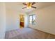 Bright bedroom with en-suite bathroom access, large window, and ceiling fan at 2608 Los Palos St, Las Vegas, NV 89108