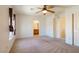 Large bedroom with neutral walls, ceiling fan, and ensuite bathroom at 2608 Los Palos St, Las Vegas, NV 89108