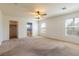 Large bedroom featuring neutral walls, ceiling fan, and ensuite bath at 2608 Los Palos St, Las Vegas, NV 89108