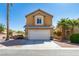 Charming two-story home featuring a neutral stucco finish, desert landscaping, and a convenient two-car garage at 2608 Los Palos St, Las Vegas, NV 89108