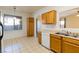 Kitchen featuring wood cabinets and views to the living areas at 2608 Los Palos St, Las Vegas, NV 89108