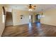 Spacious living area with wood-look floors, neutral paint, staircase, and access to multiple rooms at 2608 Los Palos St, Las Vegas, NV 89108