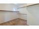 Large walk-in closet with built-in shelving and a unique round window for natural light at 2608 Los Palos St, Las Vegas, NV 89108