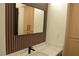 Modern bathroom vanity featuring a quartz countertop, black fixtures, and decorative accent wall at 2615 W Gary Ave # 1015, Las Vegas, NV 89123
