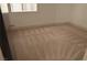 Bright bedroom featuring neutral carpet, baseboards, and a window with natural light at 2615 W Gary Ave # 1015, Las Vegas, NV 89123