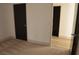 Bedroom featuring neutral carpet, doorway to the bathroom, and a doorway to another room at 2615 W Gary Ave # 1015, Las Vegas, NV 89123