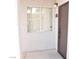 The unit entrance features neutral stucco and a window with privacy blinds at 2615 W Gary Ave # 1015, Las Vegas, NV 89123