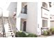 Exterior view of building with stairs leading to the upper level units and a common area at 2615 W Gary Ave # 1015, Las Vegas, NV 89123