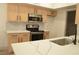 Close-up shot of kitchen showcasing quartz countertops, updated appliances and cabinets at 2615 W Gary Ave # 1015, Las Vegas, NV 89123