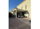 Covered back patio with brick pavers, outdoor seating and a grill at 3216 Waterstone Ave, Henderson, NV 89044