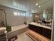 Bathroom featuring a large soaking tub, double vanity, and modern fixtures at 3216 Waterstone Ave, Henderson, NV 89044
