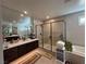 Bathroom boasting a glass-enclosed shower, double vanity, and sleek design at 3216 Waterstone Ave, Henderson, NV 89044