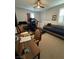 A versatile room featuring a treadmill, desk, daybed, and neutral carpet at 3216 Waterstone Ave, Henderson, NV 89044
