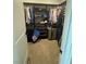 Walk-in closet featuring custom shelving, hanging rods, and carpeted flooring at 3216 Waterstone Ave, Henderson, NV 89044