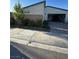 Single story home featuring an attached garage and a nicely landscaped exterior at 3216 Waterstone Ave, Henderson, NV 89044