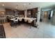 Spacious kitchen with a large island, stainless steel appliances, and stylish pendant lighting at 3216 Waterstone Ave, Henderson, NV 89044