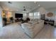 Bright and airy living room with neutral tones, tile flooring, and ample natural light at 3216 Waterstone Ave, Henderson, NV 89044