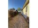 Narrow side yard featuring a stone path and minimal landscaping at 3216 Waterstone Ave, Henderson, NV 89044