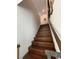 Elegant staircase with hardwood steps and a modern railing at 3216 Waterstone Ave, Henderson, NV 89044