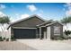 Charming single-story home features a neutral color palette and a spacious two-car garage at 3225 Walker River St, North Las Vegas, NV 89032