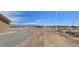 Expansive backyard with space for expansion, including partial fencing and desert landscaping at 3761 S Tumbleweed Ave, Pahrump, NV 89048