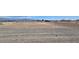 Lot features gravel, dirt, and desert foliage. Home offers plenty of potential for new owners at 3761 S Tumbleweed Ave, Pahrump, NV 89048