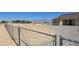 View of backyard featuring a perimeter chain-link fence, desert landscape and mountain views at 3761 S Tumbleweed Ave, Pahrump, NV 89048