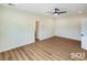 This bedroom features wood floors, neutral walls, and a modern ceiling fan at 3761 S Tumbleweed Ave, Pahrump, NV 89048