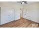 This bedroom features wood floors, neutral walls, and a closet with sliding doors at 3761 S Tumbleweed Ave, Pahrump, NV 89048