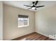 Cozy bedroom featuring a ceiling fan and a window with outside views at 3761 S Tumbleweed Ave, Pahrump, NV 89048