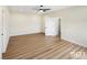 This bedroom features wood floors, neutral walls, and a closet with sliding doors at 3761 S Tumbleweed Ave, Pahrump, NV 89048