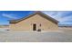 Exterior side view features neutral siding, a back door, and a well-manicured yard at 3761 S Tumbleweed Ave, Pahrump, NV 89048