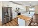 Modern kitchen with stainless steel appliances, white cabinets, and a marble-patterned countertop at 3761 S Tumbleweed Ave, Pahrump, NV 89048