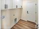 A dedicated laundry room with white cabinets and ample space at 3761 S Tumbleweed Ave, Pahrump, NV 89048
