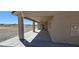 Home's back covered patio featuring a ceiling fan and seamless access to the backyard space at 3761 S Tumbleweed Ave, Pahrump, NV 89048